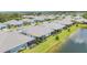Aerial view of community, showcasing backyards, water views, and well-maintained landscaping at 2631 Sapphire Blue Ln, Bradenton, FL 34211
