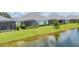 Beautiful waterfront backyard view with screened-in lanai at 2631 Sapphire Blue Ln, Bradenton, FL 34211