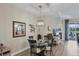 Cozy dining area with decorative lighting, and access to the outdoor space at 2631 Sapphire Blue Ln, Bradenton, FL 34211