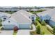 Beautiful home exterior with well-manicured landscaping and attached garage at 2631 Sapphire Blue Ln, Bradenton, FL 34211