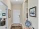 Inviting home foyer with elegant decor, hardwood floors, and a view of the living space at 2631 Sapphire Blue Ln, Bradenton, FL 34211