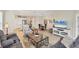 Open-concept living space with a bright living room, dining area, and modern kitchen at 2631 Sapphire Blue Ln, Bradenton, FL 34211
