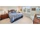 Comfortable primary bedroom features ample natural light and neutral decor at 2631 Sapphire Blue Ln, Bradenton, FL 34211