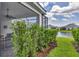Landscaped patio with partial view of pond at 2631 Sapphire Blue Ln, Bradenton, FL 34211