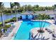 Aerial view of a stunning community pool, lounge area, and hot tub surrounded by lush landscaping at 2631 Sapphire Blue Ln, Bradenton, FL 34211