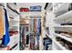Walk-in closet featuring many shelves, drawers, and racks for ample clothing storage at 2631 Sapphire Blue Ln, Bradenton, FL 34211