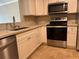 Bright kitchen featuring stainless steel appliances and modern countertops at 2650 Coconut Bay Ln # 521, Sarasota, FL 34237