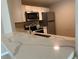 Kitchen featuring stainless steel appliances and modern countertops at 2650 Coconut Bay Ln # 521, Sarasota, FL 34237
