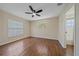 Inviting bedroom with wood floors, ceiling fan, and ample natural light at 2953 Oak St, Sarasota, FL 34237