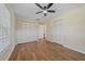 Bedroom with wood-look flooring, two closets, and a window to allow for ample natural light at 2953 Oak St, Sarasota, FL 34237