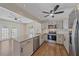 Updated kitchen with a granite-topped breakfast bar and stainless steel appliances at 2953 Oak St, Sarasota, FL 34237