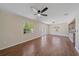 Open living room with wood floors, ceiling fan, and natural light at 2953 Oak St, Sarasota, FL 34237