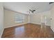 Living room with wood-look floors, neutral paint and a door to the outside at 2953 Oak St, Sarasota, FL 34237
