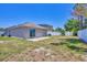 A spacious backyard with a sliding glass door for indoor-outdoor living and a well-maintained fence at 3429 97Th E Ln, Palmetto, FL 34221