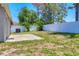 Spacious backyard with a concrete patio and a white fence, perfect for outdoor activities at 3429 97Th E Ln, Palmetto, FL 34221