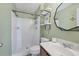 Cozy bathroom featuring tile shower, updated vanity, mirror, and shelving at 3429 97Th E Ln, Palmetto, FL 34221