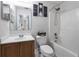 Bathroom featuring a tub/shower combo, vanity with a wooden cabinet, and decorative wall art at 3429 97Th E Ln, Palmetto, FL 34221