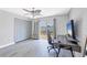 Bedroom featuring neutral walls, sliding glass doors, closet, ceiling fan, and modern decor at 3429 97Th E Ln, Palmetto, FL 34221