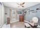 Bright room with nice floors, ceiling fan, chest of drawers and chair with foot stool at 3429 97Th E Ln, Palmetto, FL 34221
