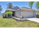 Charming single-story home features a well-manicured lawn, a two car garage, and lovely curb appeal at 3429 97Th E Ln, Palmetto, FL 34221