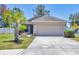 Inviting one-story home featuring a two-car garage, tidy landscaping, and a well-maintained driveway at 3429 97Th E Ln, Palmetto, FL 34221