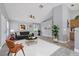 Nicely decorated living room with modern furnishings, art, and an open layout to kitchen at 3429 97Th E Ln, Palmetto, FL 34221