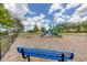 Community playground with swings, a slide, and climbing equipment, offering a fun space for to play at 3429 97Th E Ln, Palmetto, FL 34221