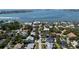 Aerial view showcasing stunning waterfront homes with mature landscaping and easy access to bay waters at 3446 Anglin Dr, Sarasota, FL 34242