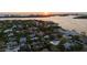 Sunset aerial showcasing a waterfront neighborhood with stunning water views and city skyline at 3446 Anglin Dr, Sarasota, FL 34242