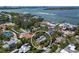 Aerial view of the home showcasing its mature landscaping and proximity to beautiful bay waters at 3446 Anglin Dr, Sarasota, FL 34242