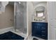 Modern bathroom with a glass-enclosed shower, sleek vanity, and stylish decor at 3446 Anglin Dr, Sarasota, FL 34242