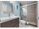 Modern bathroom featuring a glass-enclosed shower with tile surround and updated vanity at 3446 Anglin Dr, Sarasota, FL 34242