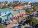 Charming commercial district with colorful storefronts, palm trees, and street parking at 3446 Anglin Dr, Sarasota, FL 34242