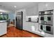 Well-equipped kitchen with stainless steel appliances and ample storage, adjacent to dining area at 3446 Anglin Dr, Sarasota, FL 34242