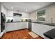 Bright kitchen featuring white cabinets, granite counters, stainless appliances and stylish backsplash at 3446 Anglin Dr, Sarasota, FL 34242