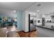 Open concept kitchen with stainless steel appliances connected to a cozy living room space at 3446 Anglin Dr, Sarasota, FL 34242