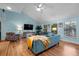 Inviting living room with wood floors, blue walls and plush seating at 3446 Anglin Dr, Sarasota, FL 34242