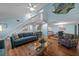 Cozy living room showcasing open floor plan, comfortable seating, and staircase to second floor at 3446 Anglin Dr, Sarasota, FL 34242