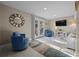 Comfortable living room with blue accent chairs, stylish rug, and French doors leading to the outside at 3446 Anglin Dr, Sarasota, FL 34242