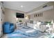 Bright living room featuring a sofa, accent chair, television and stylish decor at 3446 Anglin Dr, Sarasota, FL 34242