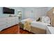 Relaxing bedroom is decorated with neutral colors, hard wood floors, and double closets at 3446 Anglin Dr, Sarasota, FL 34242