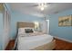 Relaxing bedroom is decorated with neutral colors, hard wood floors, and double closets at 3446 Anglin Dr, Sarasota, FL 34242