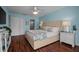 Bright main bedroom featuring a king-size bed, neutral tones, and ample closet space at 3446 Anglin Dr, Sarasota, FL 34242