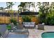 Relaxing backyard features a beautiful pool and spa with lounge chairs and outdoor seating area at 3446 Anglin Dr, Sarasota, FL 34242