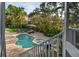 Outdoor oasis boasts a sparkling pool, spa, putting green, and lush landscaping at 3446 Anglin Dr, Sarasota, FL 34242