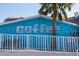 Quirky restaurant exterior with a blue sign and an inviting tropical vibe, near the beach at 3446 Anglin Dr, Sarasota, FL 34242