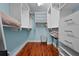 Spacious walk-in closet with custom shelving and drawers, providing ample storage space at 3446 Anglin Dr, Sarasota, FL 34242