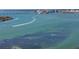 Expansive water view with boats, clear blue and green water, and a city skyline in the distance at 3446 Anglin Dr, Sarasota, FL 34242