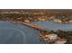 Scenic waterfront view featuring a bridge, waterfront homes, and lush landscaping at 3446 Anglin Dr, Sarasota, FL 34242