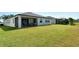 Expansive backyard features lush green grass, and a screened in lanai at 364 Grande Vista Blvd, Bradenton, FL 34212